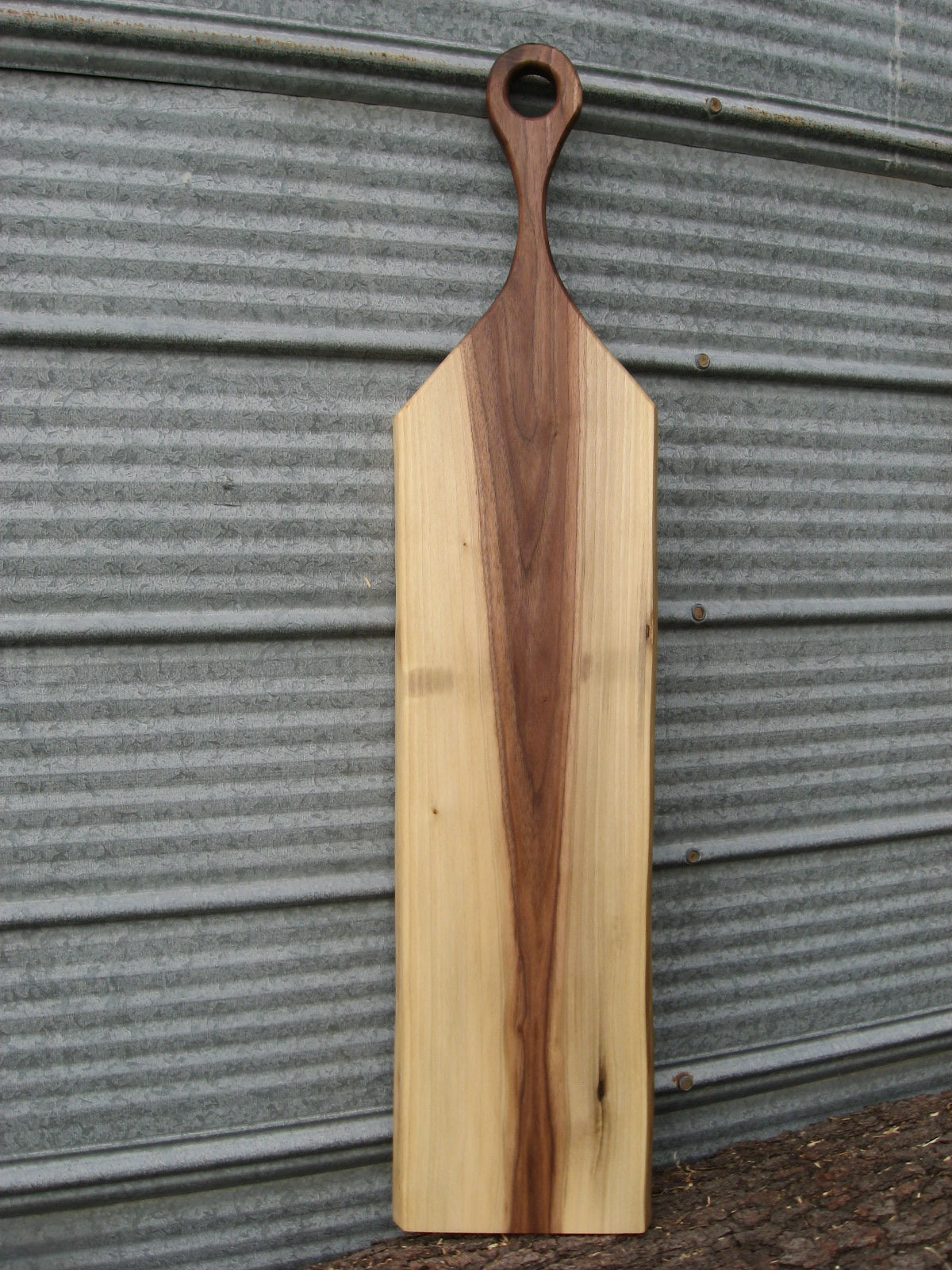 Black walnut charcuterie cheese board with handle.  Front pictured