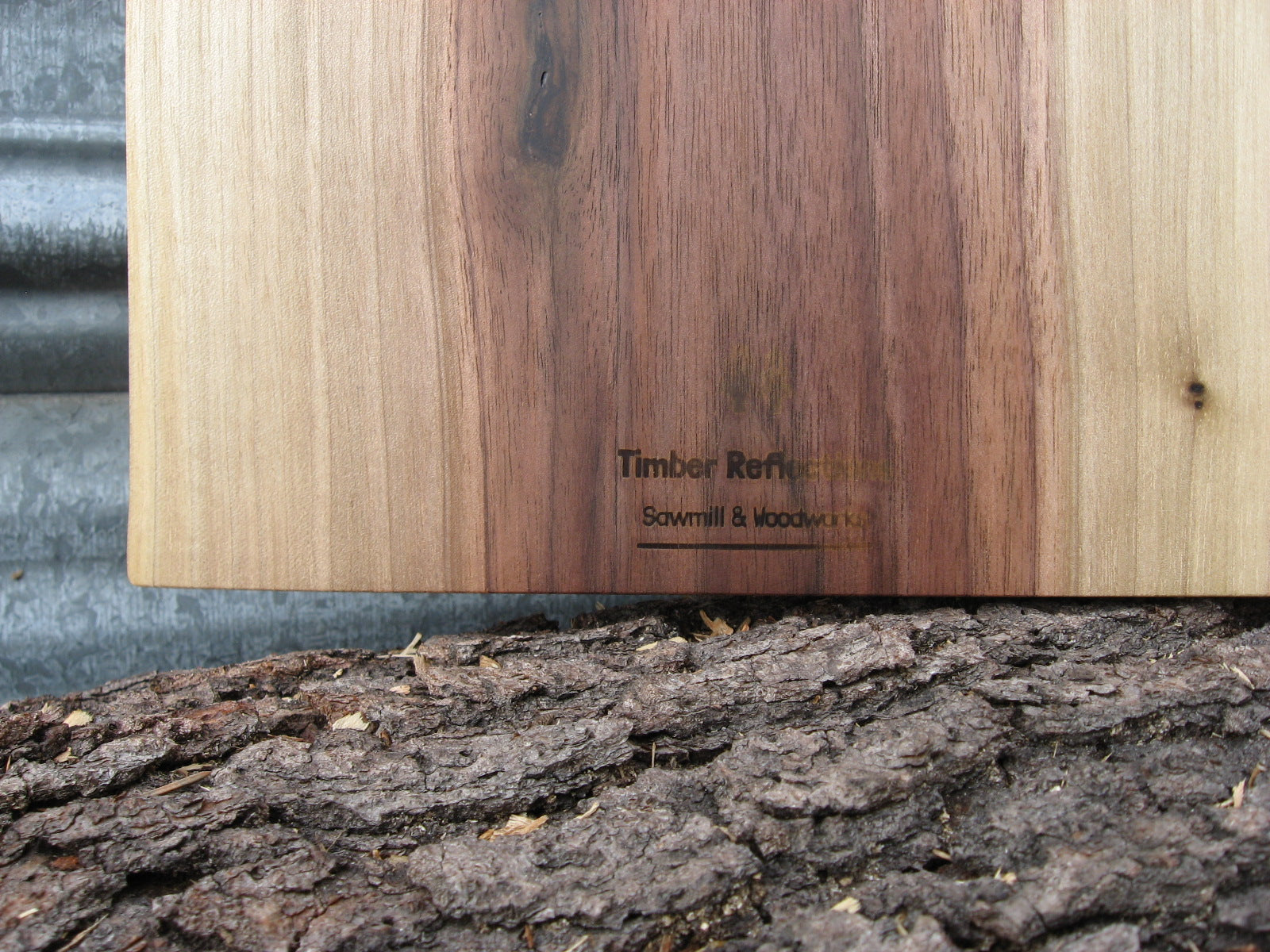 Black walnut charcuterie cheese board with handle.  Logo pictured.