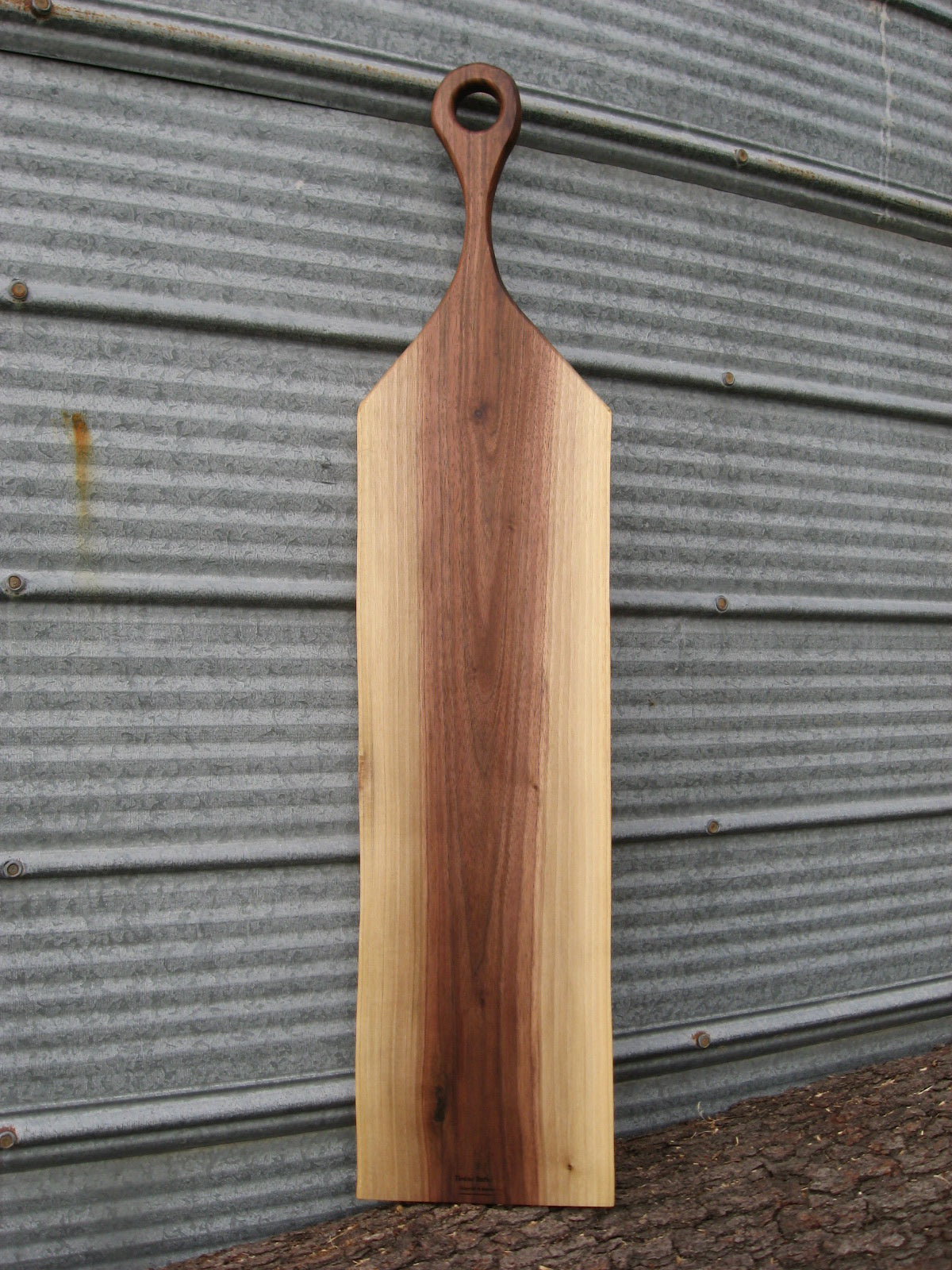 Black walnut charcuterie cheese board with handle.  Back pictured.