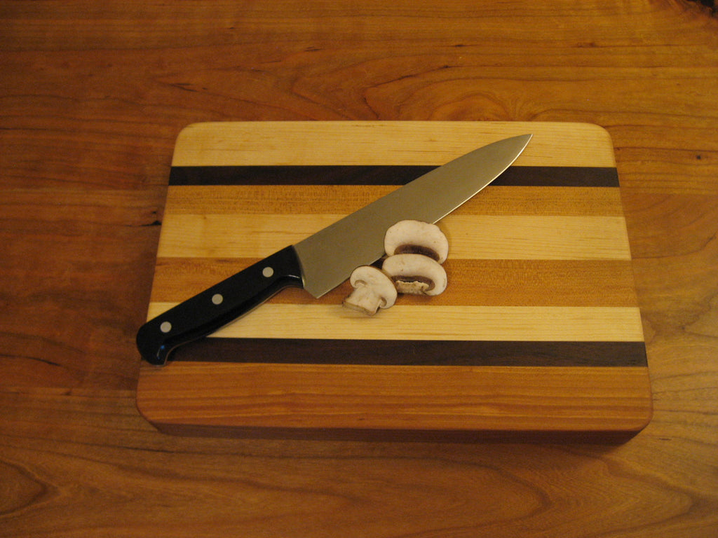 Maple, Cherry, and Black Walnut long grain medium sized cutting board/cheese board/serving tray. Smooth side pictured.