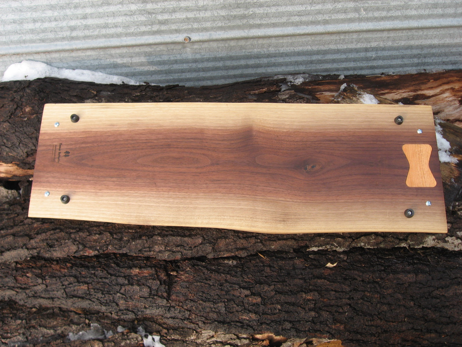 Live Edge Black Walnut Charcuterie Board Serving Tray with Black Metal Handles.  Underside pictured.