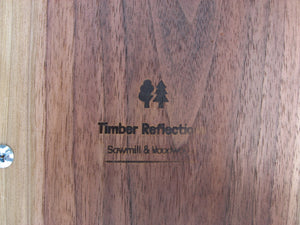 Live Edge Black Walnut Charcuterie Board Serving Tray with Black Metal Handles.  Logo on underside pictured.